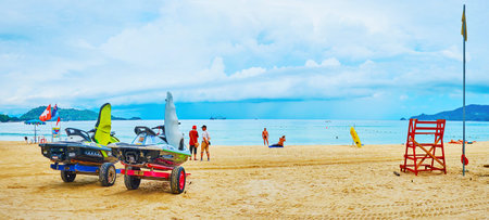 PATONG, THAILAND - APRIL 30, 2019: Panorama of the central beach of resort with sea scooters on trailers at the rental point, on April 30 in Patongのeditorial素材
