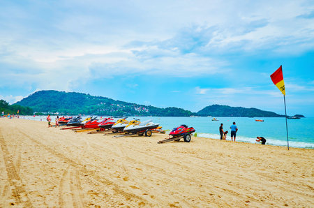 PATONG, THAILAND - APRIL 30, 2019: The line of sea scooters on the shore of Andaman sea; these vehicles are very popular among local tourists, so Patong beach has many rental points, on April 30 in Patongのeditorial素材