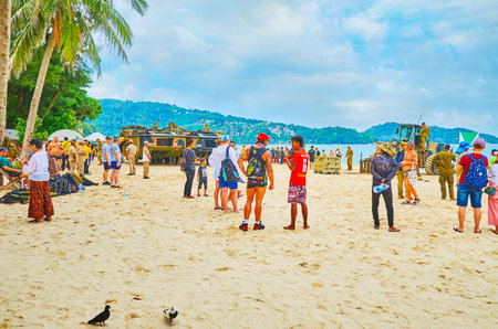 PATONG, THAILAND - APRIL 30, 2019: A crowd of tourists watches the military training on the beach: marines have landed with amphibian tanks and other equipment, on April 30 in Patongのeditorial素材