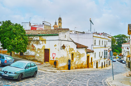 JEREZ, SPAIN - SEPTEMBER 20, 2019: Calle Espiritu Santo (Holy Spirit street) is the hilly curved thoroughfare, located in old town and lined with shabby houses, historical wineries and churches, on September 20 in Jerezのeditorial素材