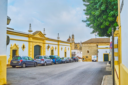 JEREZ, SPAIN - SEPTEMBER 20, 2019: The quiet hilly Calle San Ildefonso street with old buildings of Bodegas Fundador winery, occupying the quarters of Old Town, on September 20 in Jerezのeditorial素材