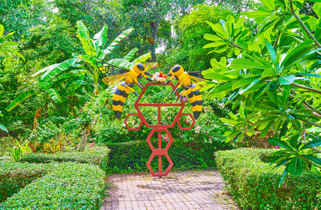 The sculpture of honeycombs and flying bees in garden of honey farm in Phuket, Thailandのeditorial素材