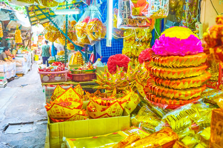 BANGKOK, THAILAND - APRIL 15, 2019: Numerous colorful Chinese religion items in street market of Chinatown, on April 15 in Bangkokのeditorial素材