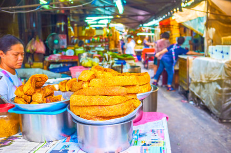 BANGKOK, THAILAND - APRIL 15, 2019: The fried lard on the showcase of the street Sampheng market stall in Chinatown, on April 15 in Bangkokのeditorial素材