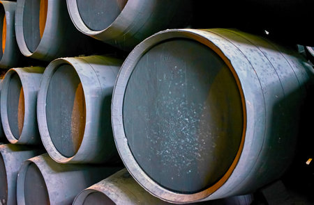 JEREZ, SPAIN - SEPTEMBER 20, 2019: Close-up of old black oak sherry casks in Bodegas Tio Pepe winery of Gonzalez Byass Sherry House, on September 20 in Jerezのeditorial素材