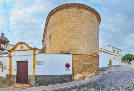 JEREZ, SPAIN - SEPTEMBER 20, 2019: The medieval gate of Espiritu Santo (Holy Spirit) Dominican Monastery, neighboring with Bodegas Fundador winery building, on September 20 in Jerezのeditorial素材