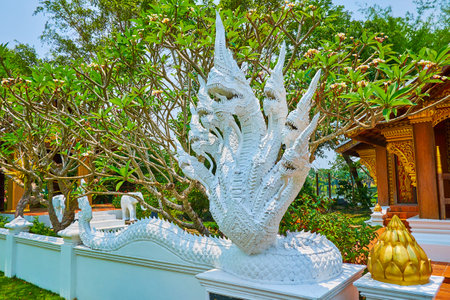 The multi-headed Naga serpent at the replica of Wat Xieng Thong Lao Temple, located in Laos garden, Rajapruek park, Chiang Mai, Thailandのeditorial素材