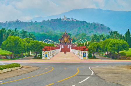 CHIANG MAI, THAILAND - MAY 7, 2019: The Royal Alley of  Rajapruek park with Royal Pavilion and green mountains on the background, on May 7 in Chiang Maiのeditorial素材