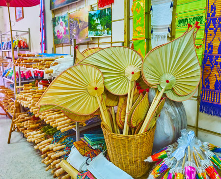 BORSANG, THAILAND - MAY 7, 2019: The souvenir store with traditional Borsang handicrafts - paper umbrellas, fans and Lanna flags, on May 7 in Borsangのeditorial素材