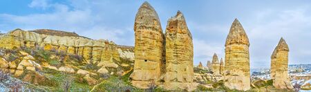 Panoramic vista of tall finger-like rock formations, known as fairy chimney rocks of Goreme, Cappadocia, Turkeyの写真素材