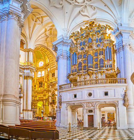 GRANADA, SPAIN - SEPTEMBER 25, 2019: The prayer hall of Incarnation Cathedral with a view on organ, decorated with gilt plasterwork and sculptures, on September 25 in Granadaのeditorial素材