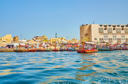 DUBAI, UAE - MARCH 2, 2020: The busy abra boat station at the Deira bank of Dubai Creek, on March 2...