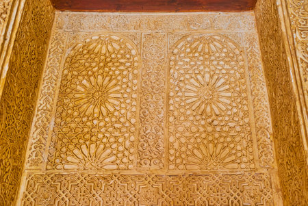 GRANADA, SPAIN - SEPTEMBER 25, 2019: The Gilded Room (Nasrid Palace of Alhambra) contains fine examples of sebka plasterwork decoration with floral, geometric and stellar Islamic patterns, on September 25 in Granadaのeditorial素材