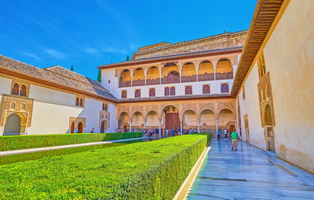 GRANADA, SPAIN - SEPTEMBER 25, 2019: The shady Court of Myrtles (Nasrid Palace, Alhambra) with topiary bushes and masterpiece sebka plasterwork on walls and arcades, on September 25 in Granadaのeditorial素材