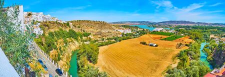 Panorama of the fields, meadows and orchards, surrounded by Guadalete river bend and huge rock of Arcos, Spainの写真素材