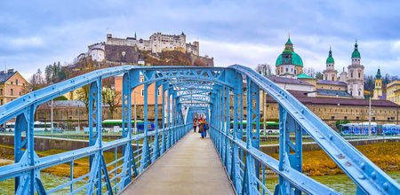 SALZBURG, AUSTRIA - MARCH 1, 2019: Stylish Mozartsteg footbridge is one of the most beloved places for making selfies with great view on old town, on March 1 in Salzburgのeditorial素材