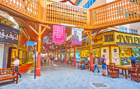 DUBAI, UAE - MARCH 2, 2020: The open air junction in the Gold Souq, decorated with carved wooden panels and pillar; lined with jewelry stores and souvenir stalls, on March 2 in Dubaiのeditorial素材