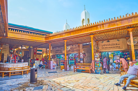 DUBAI, UAE - MARCH 2, 2020: The square in Grand Souq of Deira with fountain, benches and stores, offering different goods, on March 2 in Dubaiのeditorial素材