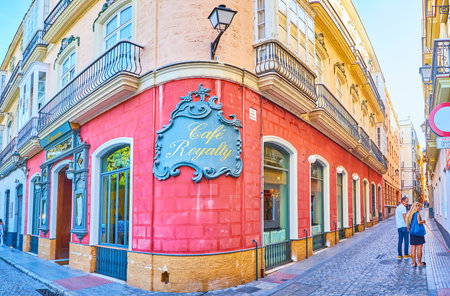 CADIZ, SPAIN - SEPTEMBER 23, 2019: The corner of the edifice with vintage plaster sign board of Cafe Royalty, located in Plaza Candelaria square, on September 23 in Cadizのeditorial素材