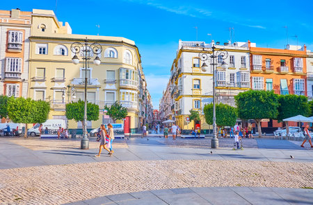 CADIZ, SPAIN - SEPTEMBER 23, 2019: The Plaza de San Antonio square with historical edifices and the view on narrow shady Calle Ancha street, on September 23 in Cadizのeditorial素材
