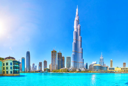 DUBAI, UAE - MARCH 3, 2020: The amazing panorama of the Burj Khalifa tower and its surrounding skyscrapers with large lake on foreground, on March 3 in Dubaiのeditorial素材