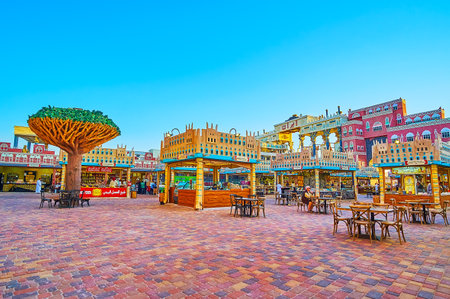 DUBAI, UAE - MARCH 5, 2020: The food court of Yemen pavilion of Global Village Dubai with small stalls, tables and chairs, on March 5 in Dubaiのeditorial素材