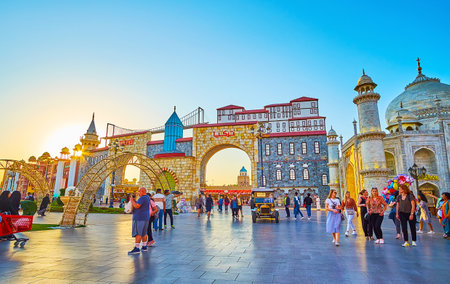 DUBAI, UAE - MARCH 5, 2020: The bright sunset over pavilion of Turkey, decorated with replica of fortress wall and Konya green tower, Global Village Dubai, on March 5 in Dubaiのeditorial素材