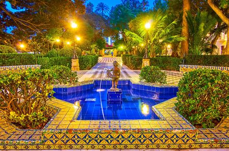 Alameda Apodaca garden is decorated with statues, memorials, fountains, vintage lanterns, alcoves and Andalusian tilling, Cadiz, Spainの写真素材