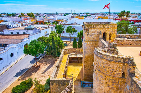 The medieval Santiago Castle adjoins with quarter of histroical wineries (bodegas), widely spread on grounds of Sherry Triangle, Sanlucar, Spainのeditorial素材