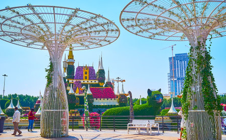 DUBAI, UAE - MARCH 5, 2020: The giant airy white sunshades in front of the floral fairytale castle of Miracle Garden, on March 5 in Dubaiのeditorial素材