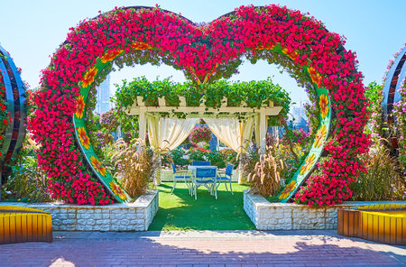 DUBAI, UAE - MARCH 5, 2020: Enjoy the open air terrace of the restaurant in Miracle Garden, decorated with heart arch, on March 5 in Dubaiのeditorial素材
