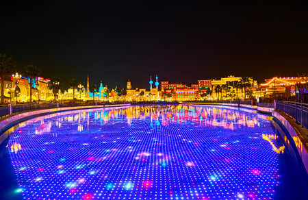 DUBAI, UAE - MARCH 5, 2020: Watch the light show on underwater LED screen in pond of Global Village Dubai, lined with pavilions of different countries, on March 5 in Dubaiのeditorial素材