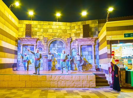 DUBAI, UAE - MARCH 5, 2020: The artists perform traditional cane dance, singing and drum music in Syria pavilion of Global Village Dubai, on March 5 in Dubaiのeditorial素材