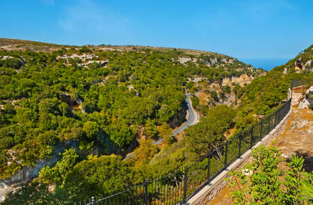 picturesque mountain landscape of a view  Arkadi Gorge and  Cretan sea in background, Greeceの写真素材