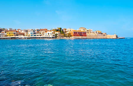port of Chania overlooks  medieval housing of Akti Kountourioti  and stone rampart of Firkass Fortressの写真素材