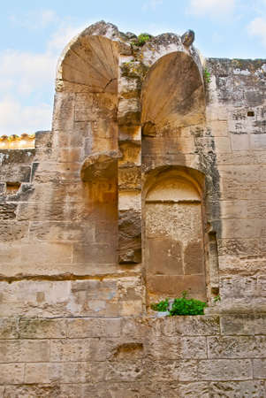 The ruined wall of the medieval building with remains of the decorative ceiling elements, semi-domes, Les Baux-de-Provence, Franceの写真素材