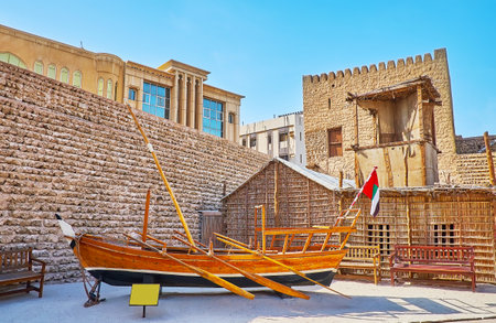 Explore historic way of life in court of Al Fahidi Fort, here one can find traditional wooden boats and the arish summer house, made of palm tree branches and fibres, Dubai, UAEのeditorial素材