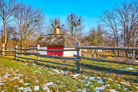 The view of the old Ukrainian farmstead behind the timber fence, Pyrohiv Skansen, Kyiv, Ukraineのeditorial素材