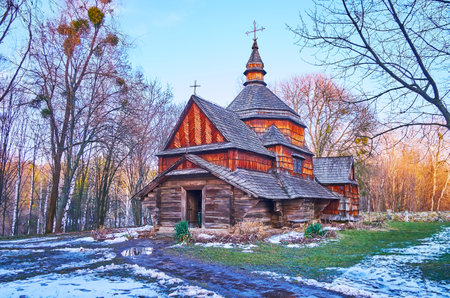 The wet snowy courtyard of Podillya Region's St Michael Church, located in Pyrohiv Skansen, Kyiv, Ukraineのeditorial素材