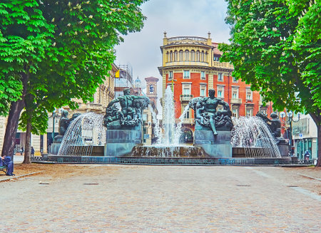 The picturesque Angelica Fountain with sculpture groups, representing four seasons, the fountain located in Piazza Solferino, Turin, Italyのeditorial素材