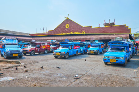 CHIANG RAI, THAILAND - MAY 11, 2019: The parking of the Central Day Market with blue songtaew pickup taxies, on May 11 in Chiang Raiのeditorial素材