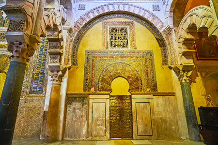 CORDOBA, SPAIN - SEP 30, 2019: The maqsura (caliph's or emir's praying area) of Mezquita with alfiz (blind arcade), richly decorated with mosaics, Islamic patterns and Kufic script, on Sep 30 in Cordobaのeditorial素材