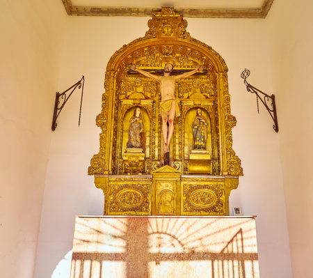 CORDOBA, SPAIN - SEPTEMBER 30, 2019: The small gilt altar of San Bartolome chapel with carvings and small sculptures, on September 30 in Cordobaのeditorial素材