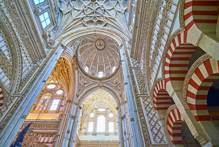 CORDOBA, SPAIN - SEP 30, 2019: The splendid vault and domes of Capilla Mayor (Main Chapel) of Mezquita- Catedral with carved decorations, on Sep 30 in Cordobaのeditorial素材