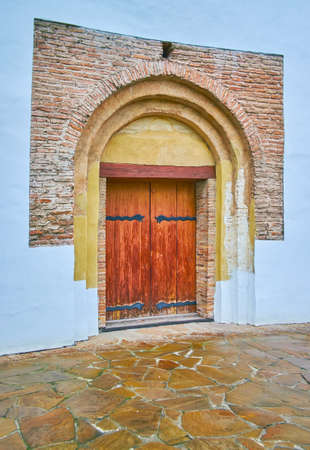 The outer wall of St Cyril Church with elements of preserved historic brickwork over the door, Kyiv, Ukraineの写真素材
