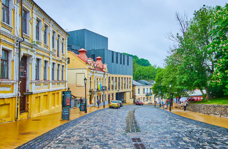 The narrow and curved Andrew's Descent is lined with historic and modern buildings, Kyiv, Ukraineのeditorial素材
