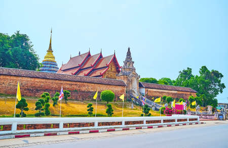 The rampart, pyathat roof and Chedi's spire of Wat Phra That Lampang Luang Temple, Lampang, Thailand