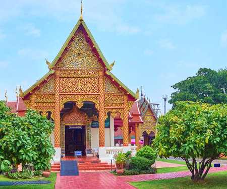 The picturesque facade of small Viharn Phra Kluai Phayai of Wat Phra That Hariphunchai Temple, Lamphun, Thailandの写真素材