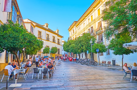 CORDOBA, SPAIN - SEPTEMBER 30, 2019: Plaza Agrupacion de Cofradias square is a nice place to relax and spend time in local outdoor cafe, on September 30 in Cordobaのeditorial素材