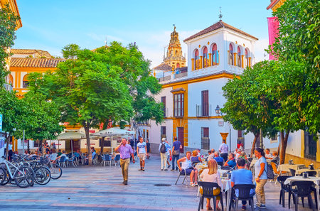 CORDOBA, SPAIN - SEPTEMBER 30, 2019: The Plaza Agrupacion de Cofradias opens the view of the bell tower of Mezquita, seen behind the old mansions, on September 30 in Cordobaのeditorial素材
